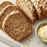 Sliced Cheesecake Factory brown bread with oats and butter