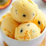 Close-up of passion fruit ice cream scoops with seeds