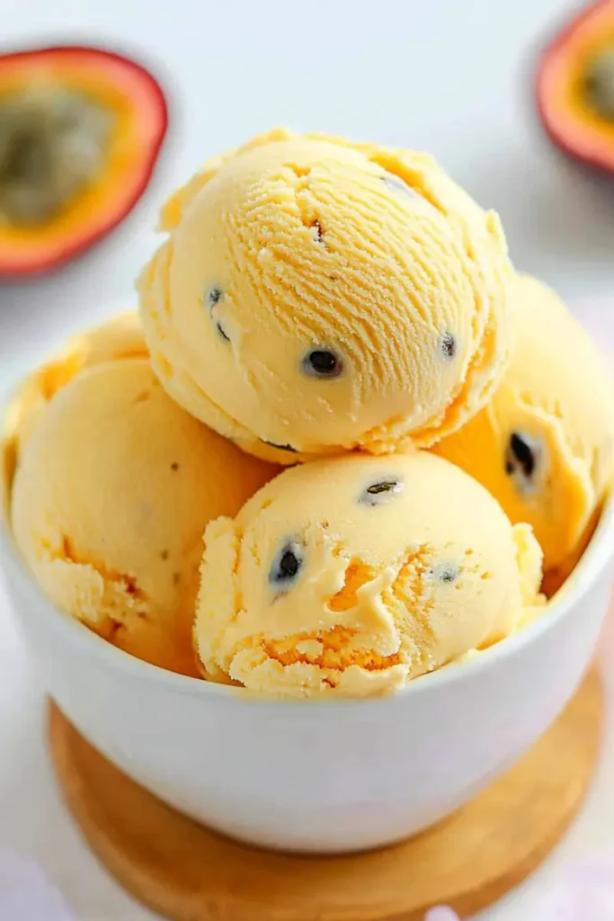 Close-up of passion fruit ice cream scoops with seeds